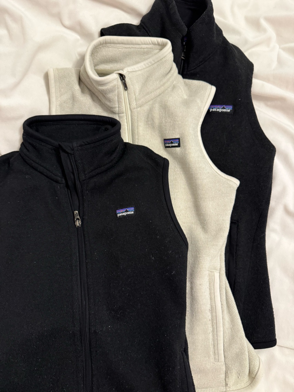 Patagonia bundle of Black and Cream Sleeveless Zip-Up Fleeces (3-Pack)